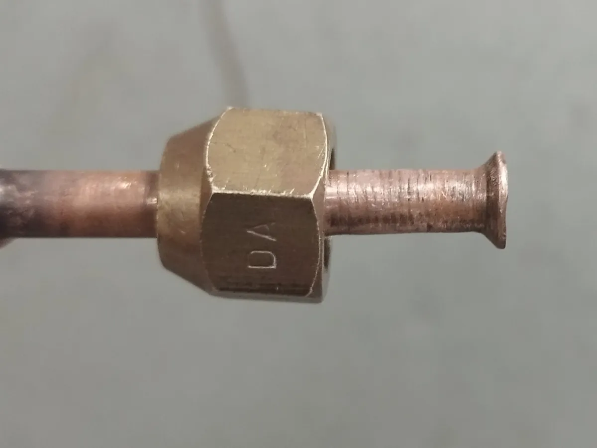 Brass threaded fitting joined to a copper pipe